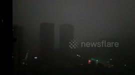Thunderstorms and torrential rain plunge sky into darkness during morning rush in China