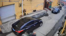 Three-wheeler mishap takes a swipe at parked car in rural Henan