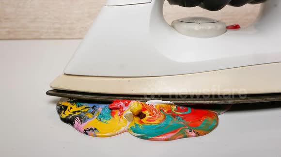 Oddly mesmerising footage as hot iron melts ice cube, ignites matches and creates wax art