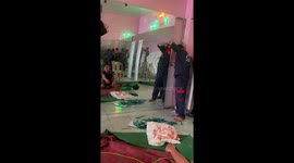 Bad day at work! A worker breaks the glass when trying to install it on the wall