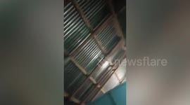 Residents shelter from gravel and stones during Mount Ruang volcano eruption