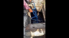 Villagers use trolley to save dog stranded in sewage