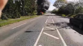 Hero saves elderly couple by dragging them out of burning car