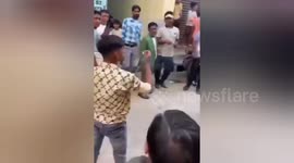 A boy got burnt due to fire while performing stunts by filling petrol in his mouth at a wedding ceremony on Northern India,local people's save his life