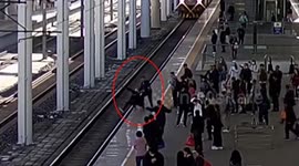 Train officer saves man from jumping onto tracks after argument with girlfriend in China