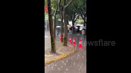 Traffic cones 'march' like soldiers in accumulated water in China