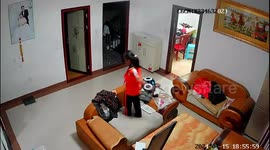 Energetic schoolgirl jumps around and breaks living room table