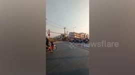 Daredevil dodges level crossing barrier as train approaches