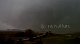 EF-2 wedge tornado near Wolbach, Nebraska Friday afternoon. This wedge was mostly wrapped in rain over the hilly Nebraska plains.