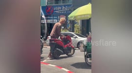 Tourist cuts chain lock on his motorcycle to evade fine