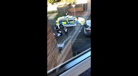 Footage from outside house in Hainault shows heavy police present as eyewitness tells attacker stabbed a young male here and then made his way towards the station