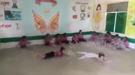A school principal converts classroom into SWIMMING POOL as temperatures soar above 40 degrees Celsius in Northern India