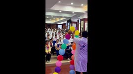Chinese physics teacher demonstrates magic balloon ring in classroom