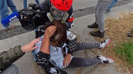 Intense footage shows moment woman gets hit in head with brick during Paris clashes