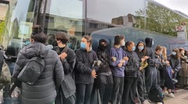 Masked protesters link arms as they block coach set to transport asylum seekers to Bibby Stockholm