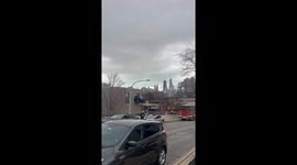 Filming of TV show stunt shows car sticking halfway out of a building