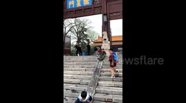 Century-old stone slope in China bears deep grooves from playful children