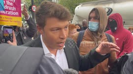 GB News presenter told to 'f*** off' by protesters blocking coach set to transport asylum seekers to Bibby Stockholm