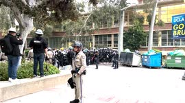 Protesters attempt to stop sheriff buses at UCLA