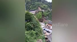 Landslide crushes houses as terrified villagers flee for their lives