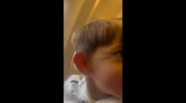 Adorable reaction of first time taking off in a plane on our holiday