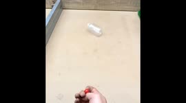 Intelligent Chinese man shows off incredible marble shooting tricks