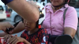Hero American gives out free motorcycle helmets to children in Thailand