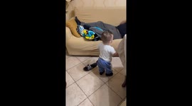 Surprise ladle attack: toddler's playful gesture takes grandfather by surprise!