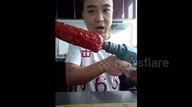Man eats tomato ketchup-covered corn on the cob... with power drill
