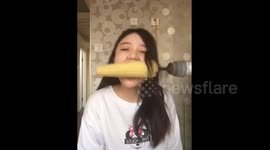 Girl tries to eat corn on the cob on a drill, ends up losing a load of hair