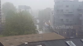 City of London skyline shrouded by heavy fog