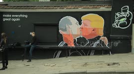 Artist paints Putin and Trump kissing on a wall