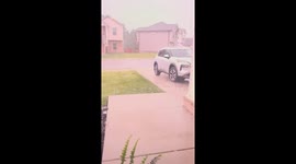 Woman filming hailstorm spooked as lightning bolt hits neighbour's house in Tennessee