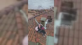 Brazil: Couple Rescued From A Rooftop Amidst Floods