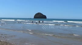 Trebarwith Strand in the heat wave , the sea is ``mediterranean`` in appearance and the kids are loving it