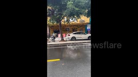 Pedestrians stunned by unexpected encounter with localised rain