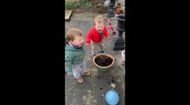 Little twins transform a bamboo wand into a compost cannon