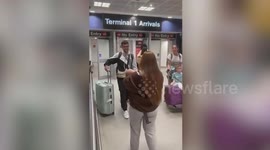 Sweet moment new dad meets two-month-old son for the first time at airport