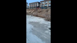 Close call! playful pup trips at missing drain cover in Liaoning Province, China