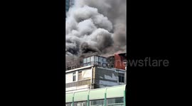 One killed as massive blaze engulfs wholesale market in southern China