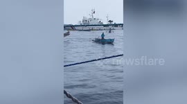 Filipino fishermen sail on 100 boat regatta to dispute shoal guarded by Chinese ships
