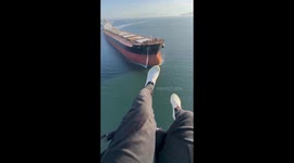 Paramotor Pilot Experiences Sudden Turbulence Over Cargo Ship