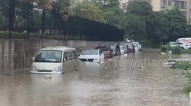 Cars drowned in flood after heavy downpours in southern China