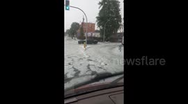Poland: Storm Brings Hail To Gniezno, Blankets Streets In White