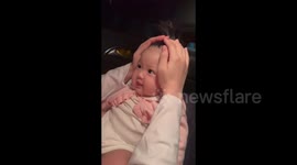 China: Adorable Baby Getting Playful Hairdo in the Car