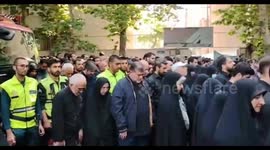 Iran: People pray over the body of the martyrs