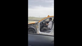 Taxi driver rides on road  without car door