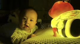 China: Baby's Sweet Smile Melts Hearts in Warm Yellow Light