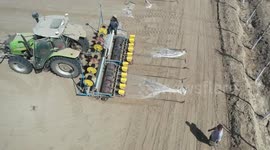 China: A Tractor Sows Cotton in Karamay