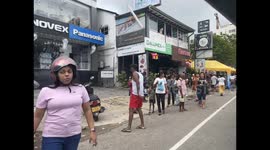 Sri Lanka: Local people queue for free ice cream distributed by city authorities on the occasion of Vesak in Galle